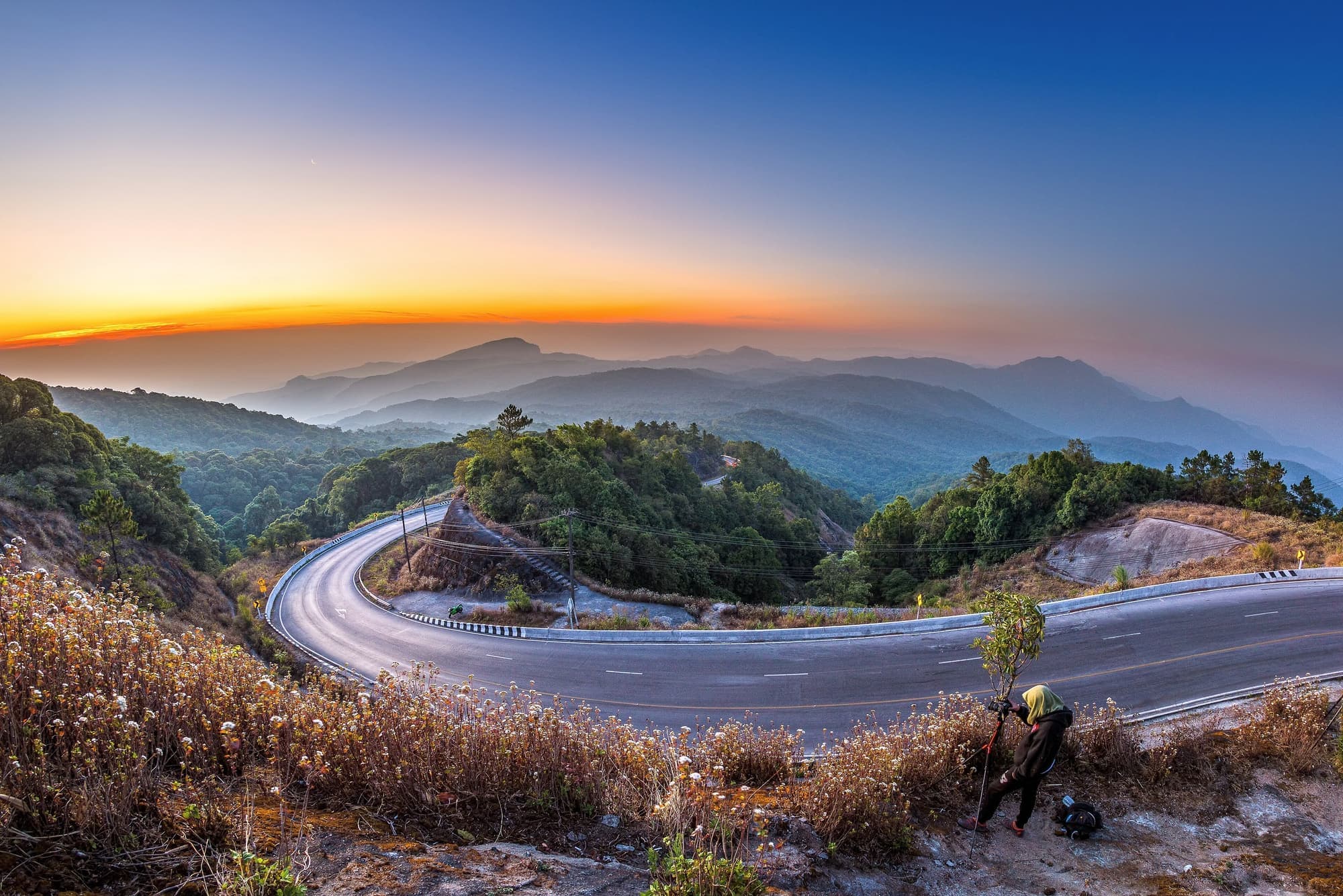 Winding mountain road at sunrise in Doi Inthanon National Park