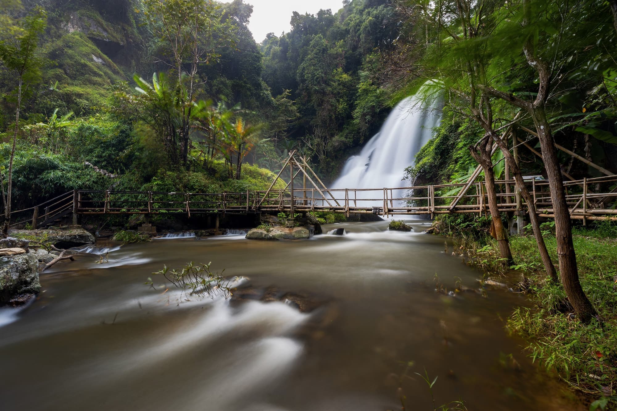 Pha Dok Siew Waterfall and its bamboo bridge along the nature trail