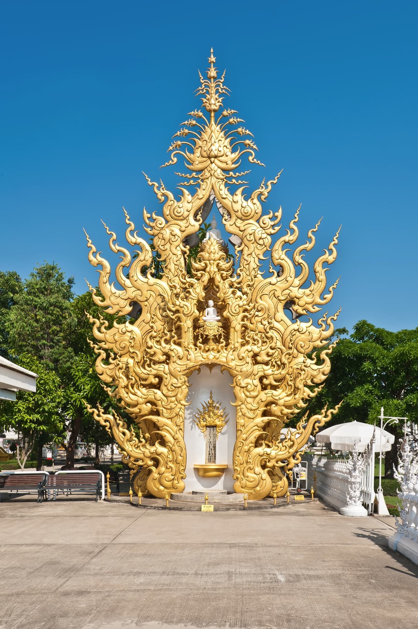 The ornate golden building at Wat Rong Khun